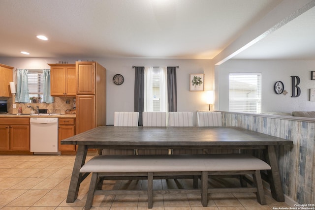 dining room with breakfast area, light tile patterned flooring, and recessed lighting