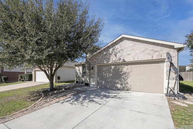 ranch-style home with brick siding, driveway, and an attached garage