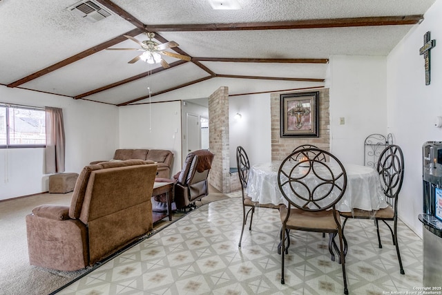 dining space featuring visible vents, ceiling fan, lofted ceiling with beams, and a textured ceiling