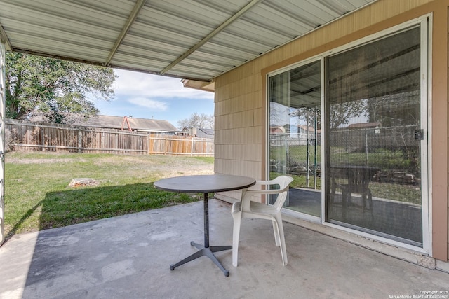 view of patio featuring fence