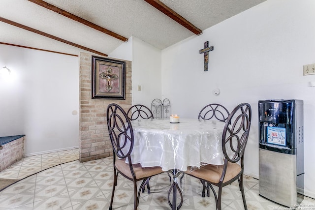 dining area with vaulted ceiling with beams, a textured ceiling, and light floors