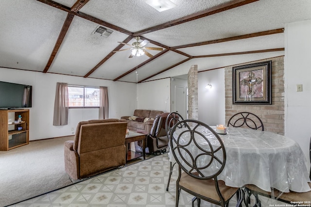 dining room with a textured ceiling, vaulted ceiling with beams, a ceiling fan, visible vents, and light floors