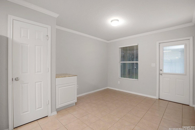 interior space with baseboards, light tile patterned flooring, and crown molding