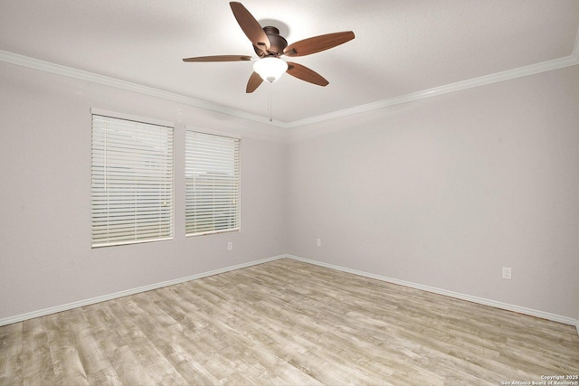 unfurnished room with light wood-type flooring, baseboards, ornamental molding, and ceiling fan