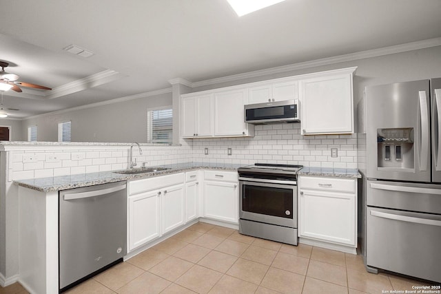 kitchen with light tile patterned floors, visible vents, decorative backsplash, appliances with stainless steel finishes, and a sink