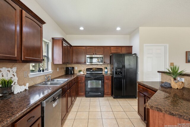 kitchen with black appliances, a sink, backsplash, recessed lighting, and light tile patterned floors