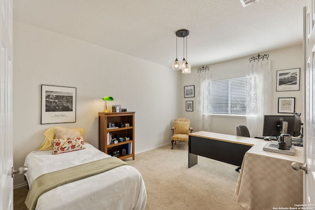 bedroom featuring baseboards and carpet