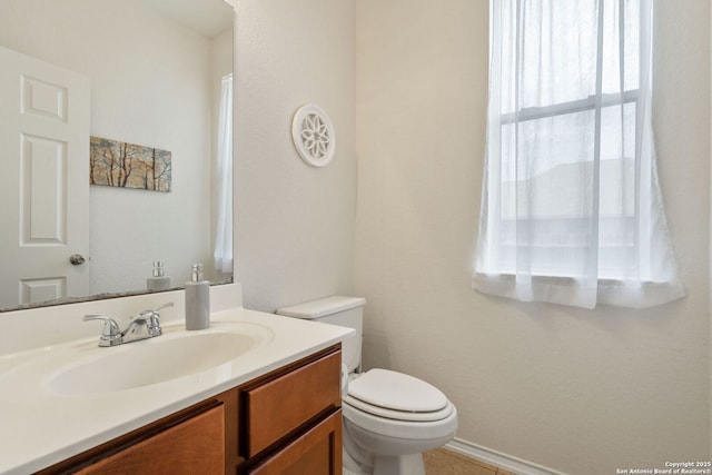 half bath with toilet and vanity