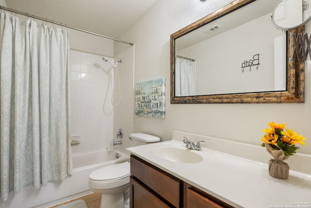 full bath with visible vents, shower / bath combo with shower curtain, toilet, and vanity