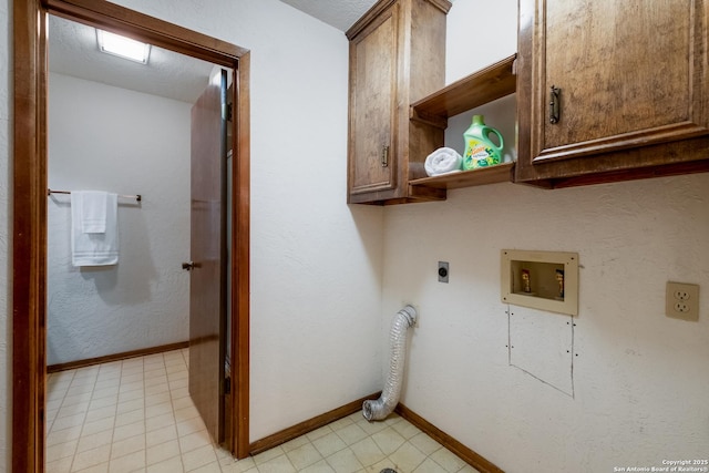 laundry area with cabinet space, baseboards, washer hookup, and electric dryer hookup