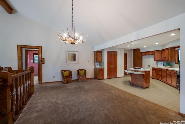 kitchen with brown cabinets, light countertops, open floor plan, light carpet, and a kitchen island