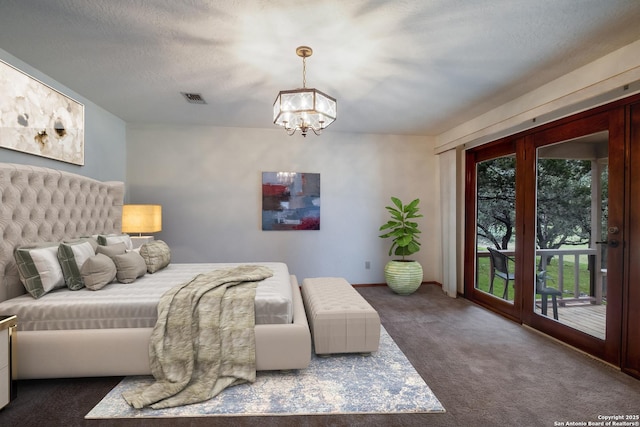 bedroom with carpet, visible vents, a textured ceiling, a chandelier, and access to outside