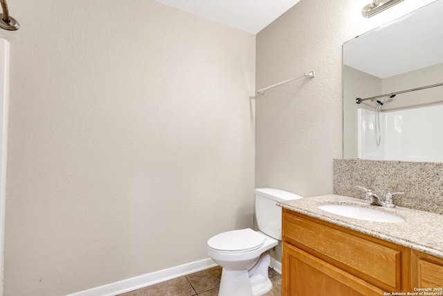 full bath featuring baseboards, a shower, toilet, tile patterned flooring, and vanity