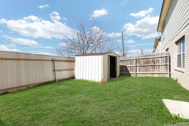 view of yard with a fenced backyard, an outdoor structure, and a shed