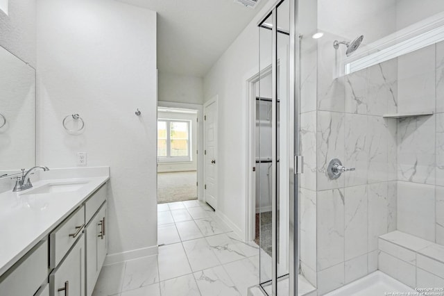 full bathroom with visible vents, vanity, marble finish floor, baseboards, and a marble finish shower