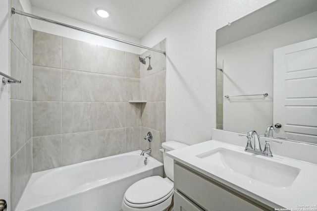 bathroom featuring vanity,  shower combination, and toilet