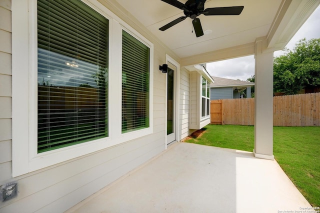 view of patio / terrace featuring fence and a ceiling fan