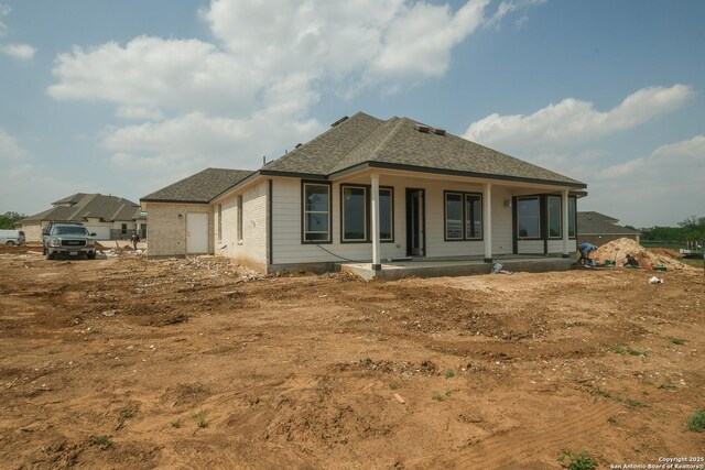 5810 Provo Pl, San Antonio, TX 78263 - back of house with a porch and a shingled roof