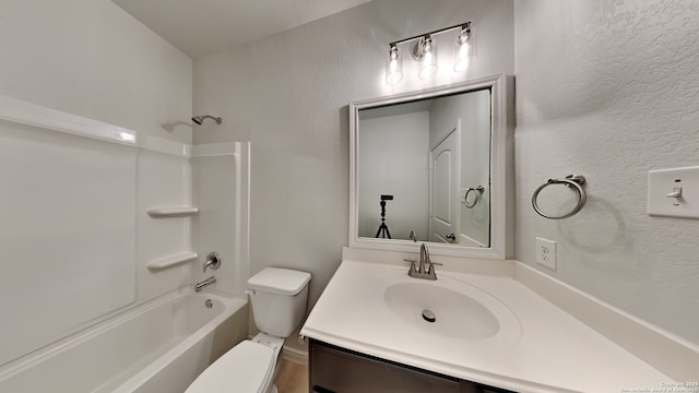 full bathroom featuring shower / washtub combination, a textured wall, vanity, and toilet