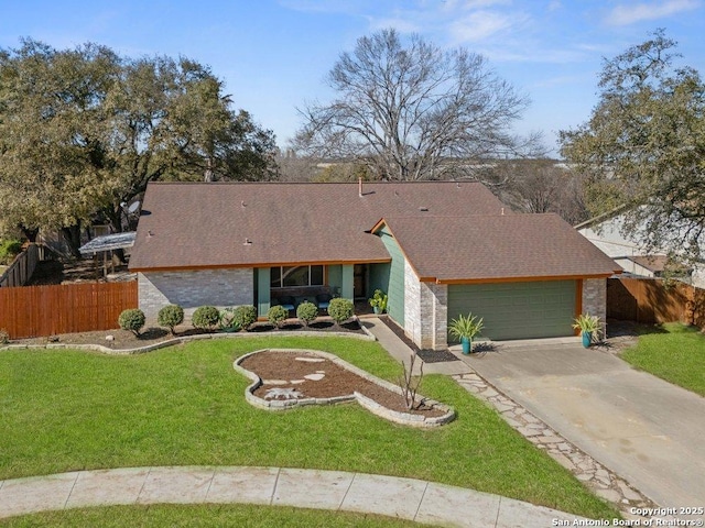 mid-century modern home with driveway, a garage, fence, a front yard, and brick siding