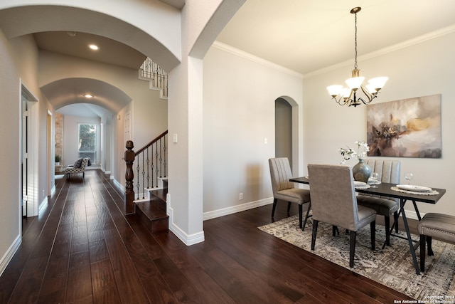 dining space with ornamental molding, baseboards, hardwood / wood-style floors, and stairs