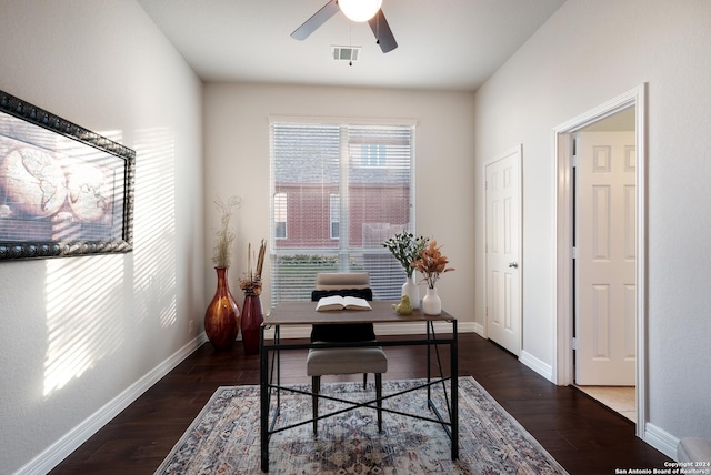 office space featuring visible vents, dark wood finished floors, and baseboards