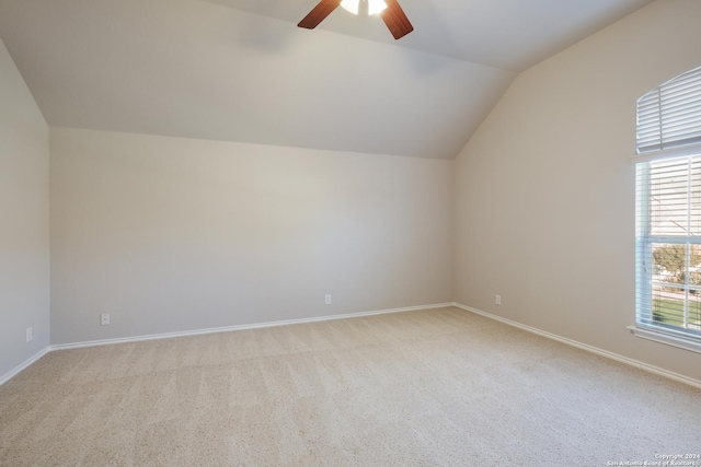 bonus room featuring light carpet, ceiling fan, baseboards, and vaulted ceiling