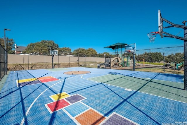 view of sport court featuring community basketball court and fence