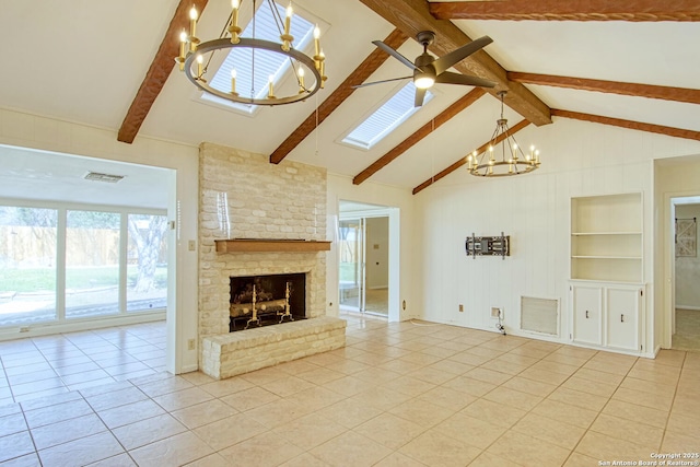 unfurnished living room with built in shelves, a brick fireplace, visible vents, and light tile patterned floors