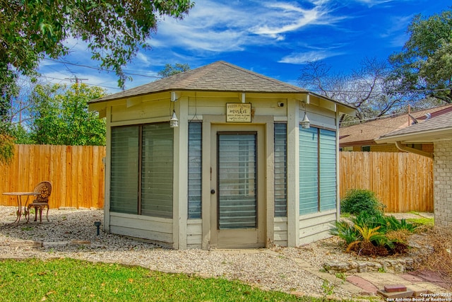 view of outbuilding with an outbuilding and a fenced backyard