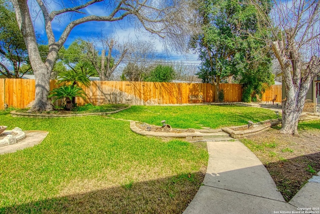 view of yard with a fenced backyard