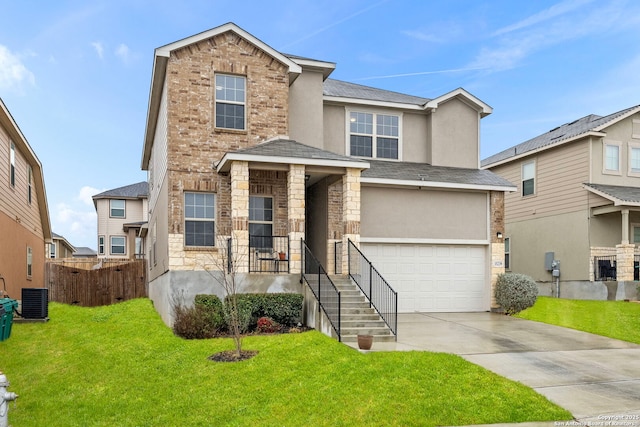 traditional-style home featuring an attached garage, fence, concrete driveway, stucco siding, and a front lawn