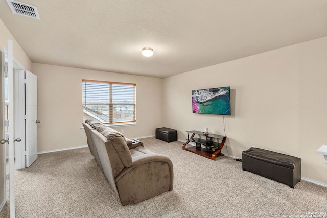 living area with carpet, visible vents, and baseboards