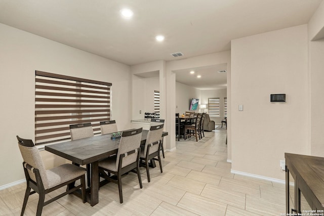 dining area with baseboards, visible vents, and recessed lighting