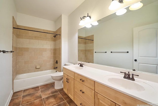 bathroom featuring bathtub / shower combination, a sink, toilet, and double vanity