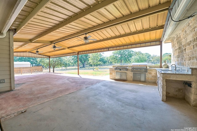 view of patio / terrace featuring an outdoor kitchen, ceiling fan, and grilling area