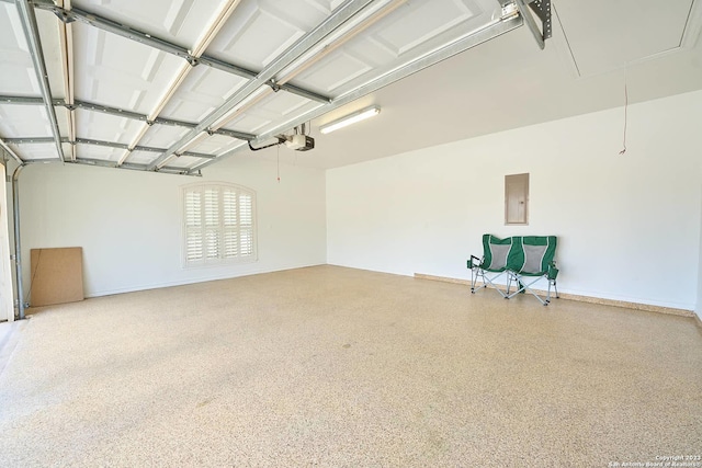 garage featuring a garage door opener and electric panel