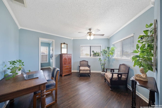 office area with baseboards, visible vents, ceiling fan, wood finished floors, and crown molding