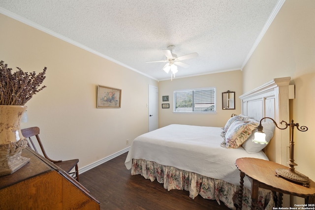 bedroom with a textured ceiling, wood finished floors, a ceiling fan, baseboards, and crown molding