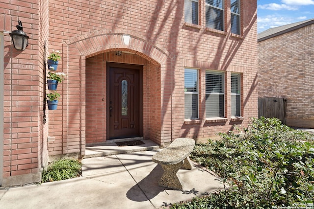 entrance to property with brick siding