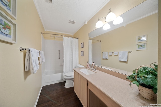 full bath with toilet, ornamental molding, wood finished floors, a textured ceiling, and vanity