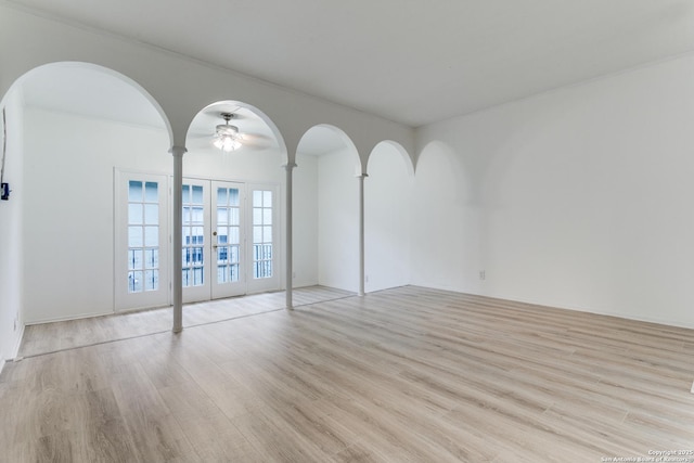 unfurnished room with french doors and wood finished floors