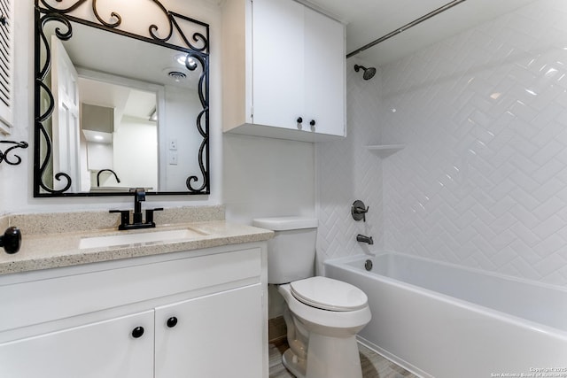 bathroom with visible vents, shower / bathing tub combination, vanity, and toilet