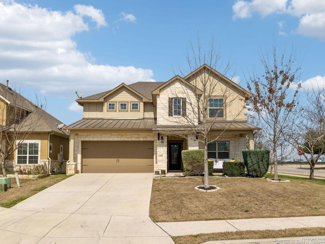 craftsman inspired home with a garage, driveway, a standing seam roof, and stone siding