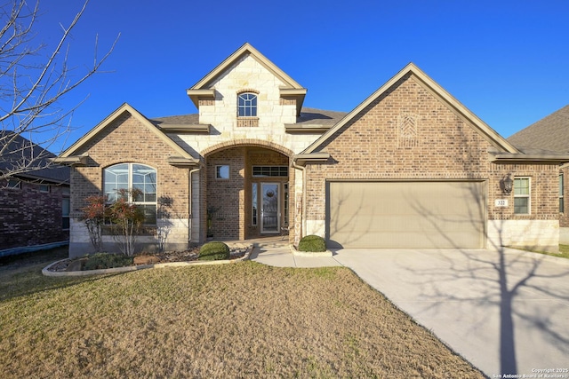 322 Wauford, New Braunfels, TX 78132 - french provincial home featuring a shingled roof, concrete driveway, brick siding, a front yard, and a garage