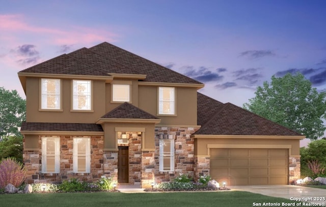 view of front of property featuring stucco siding, a shingled roof, an attached garage, stone siding, and driveway