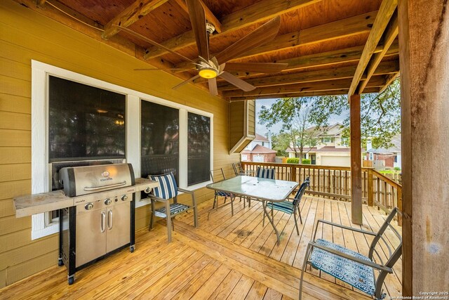 wooden deck with a ceiling fan and a grill