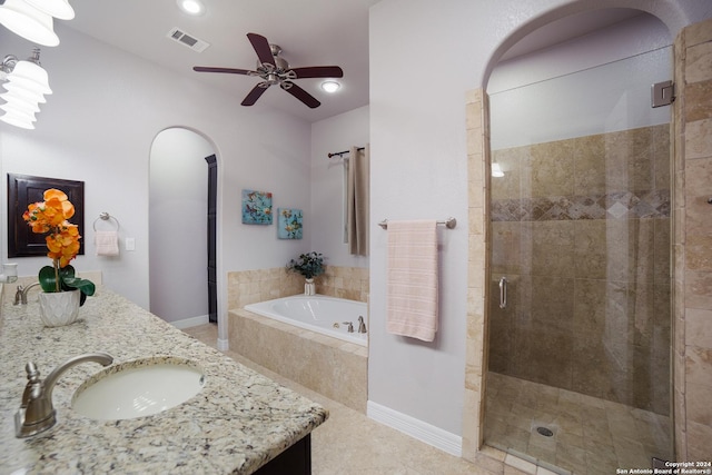 full bath with visible vents, ceiling fan, vanity, a shower stall, and a bath