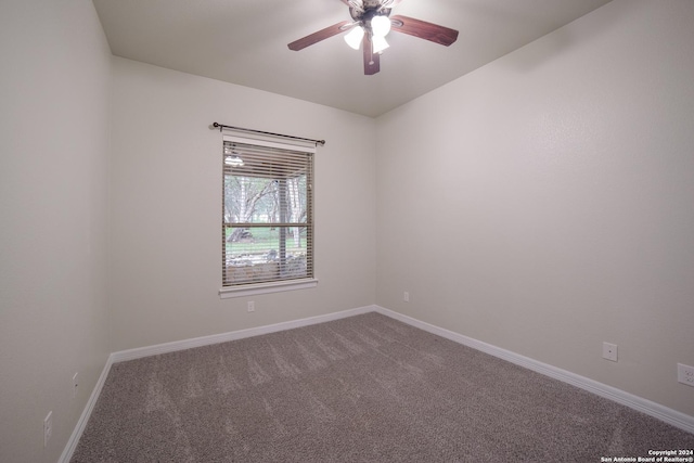 unfurnished room featuring a ceiling fan, carpet, and baseboards