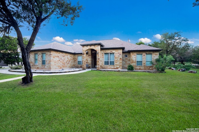 prairie-style home featuring a front yard